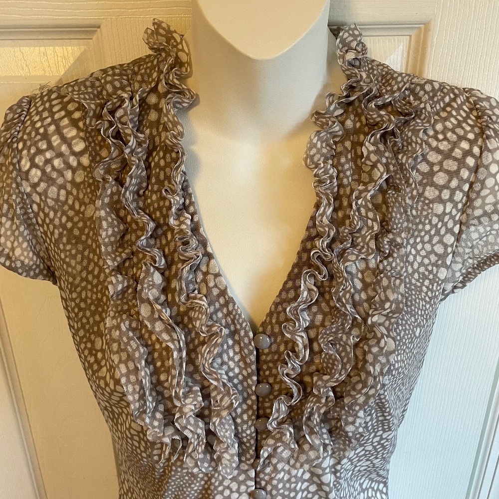 NWOT. Rayon- mesh feeling top. Lots of give and form fitting. Adorable sleeves.
